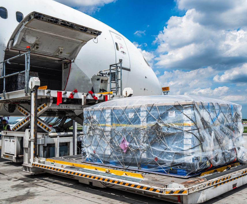 Cargo being loaded onto airplane.