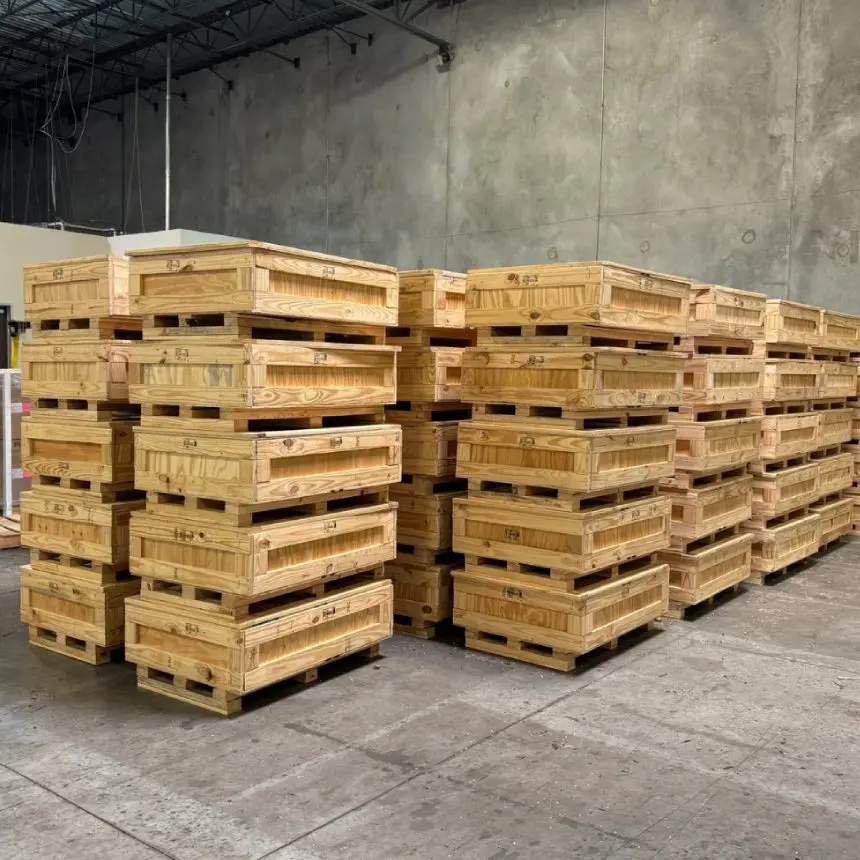 Stacked wooden shipping crates in warehouse.