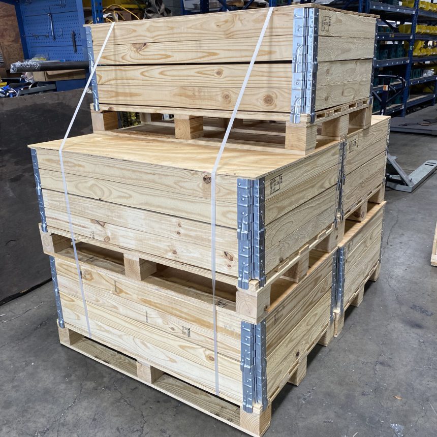 Stacked wooden crates with metal hinges.